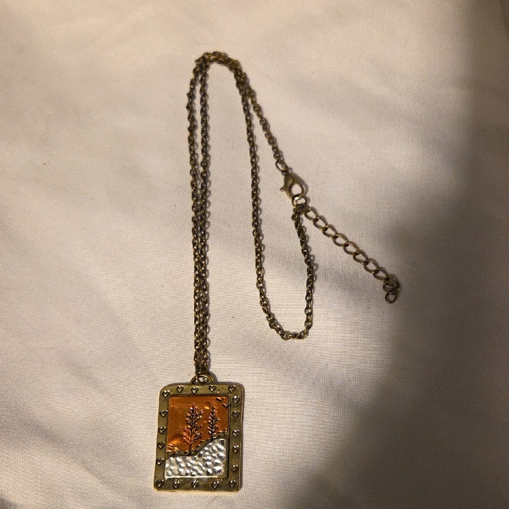 Elegant Gold and Silver Pendant Necklace